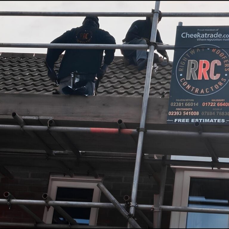 Roofers fixing roof